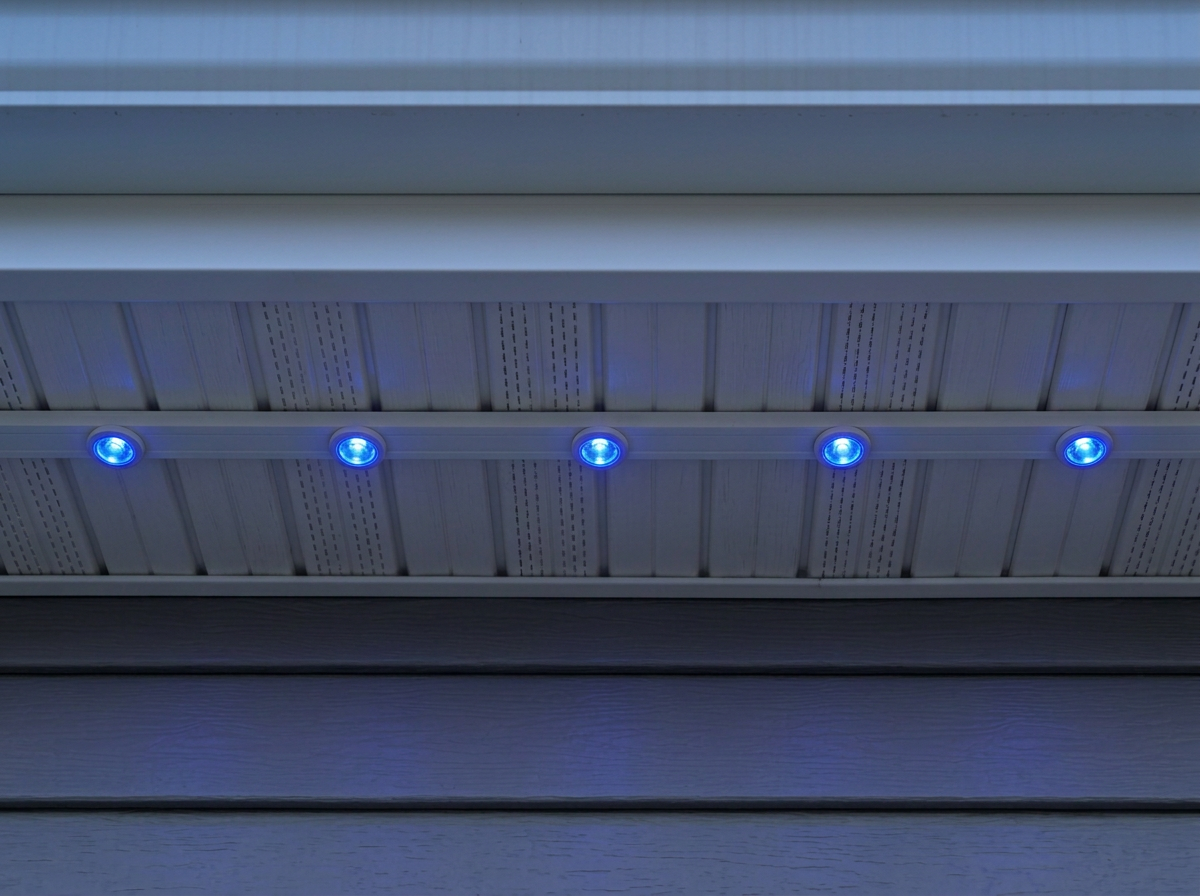 Slim permanent lighting track tucked against a white soffit